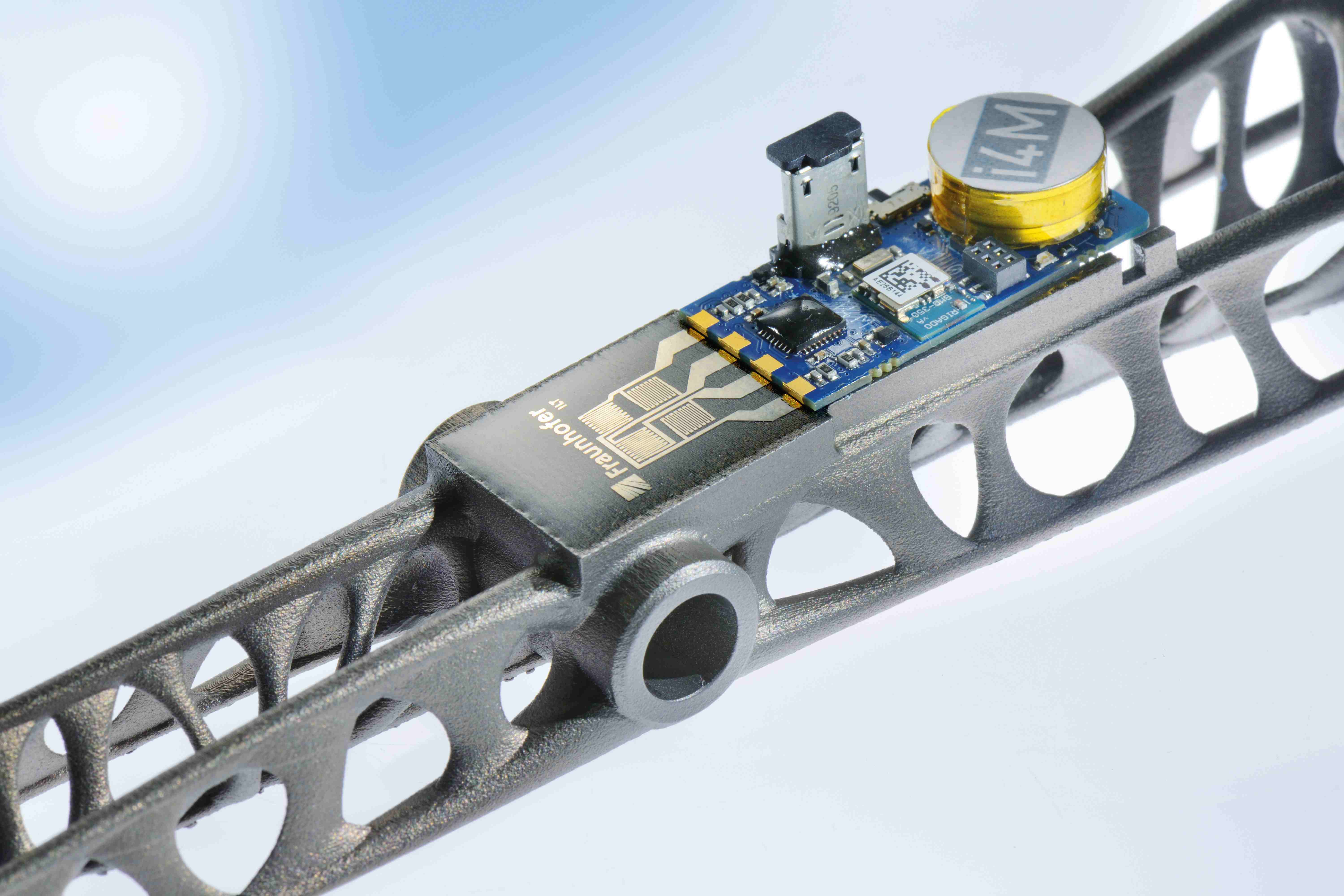 Additively manufactured, sensor-integrated component with wireless telemetry.